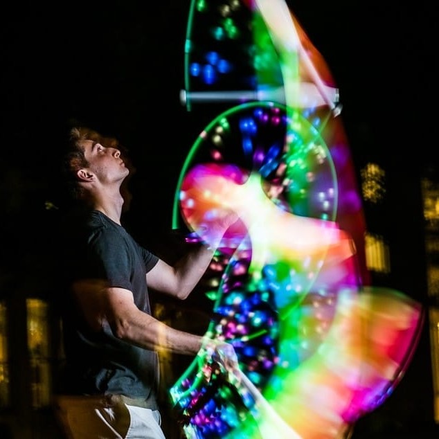 Jonah Botvinick-Greenhouse juggling glowing clubs